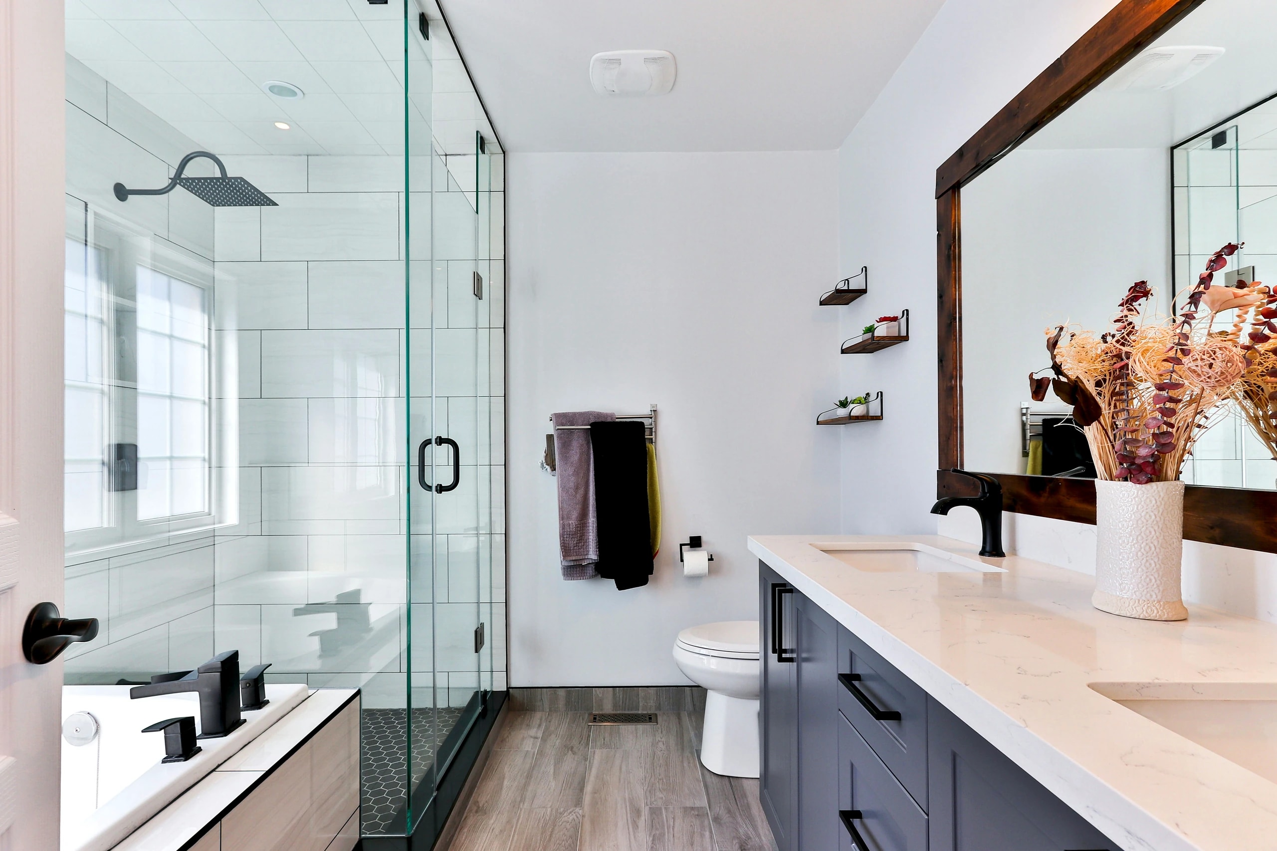 Modern bathroom with double vanity and twin ceramic sinks